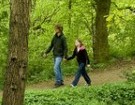 Parent and child walking in the woods