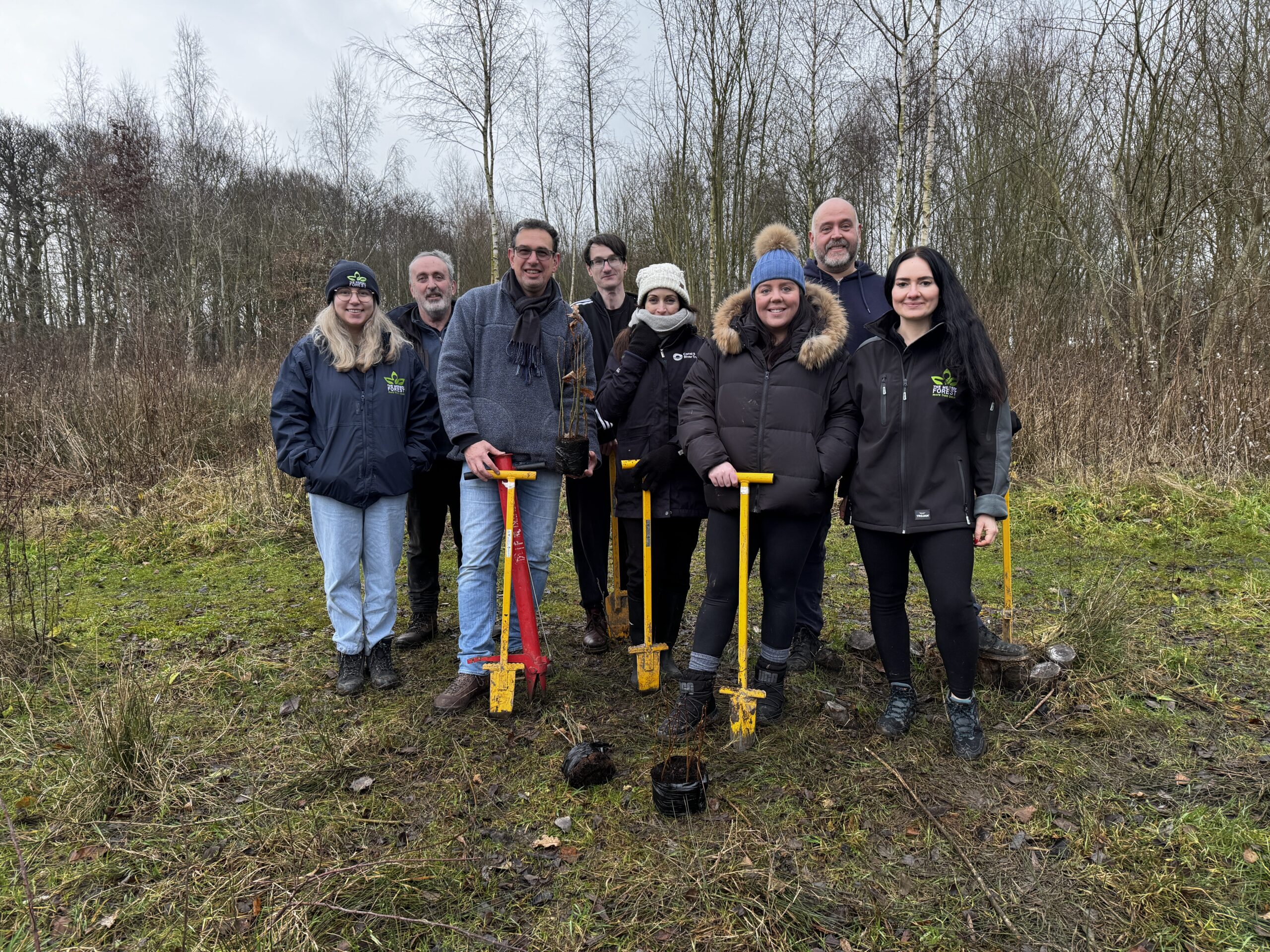 Group photo of volunteers from a local company with Mersey Forest staff.